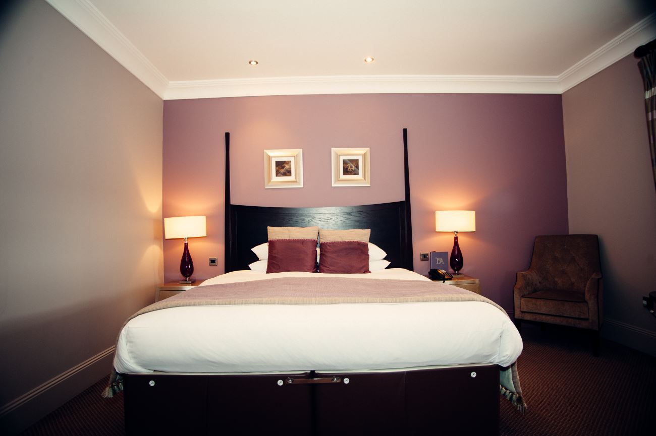 A low angle image of a bedroom in the Dumfries Arms Hotel.